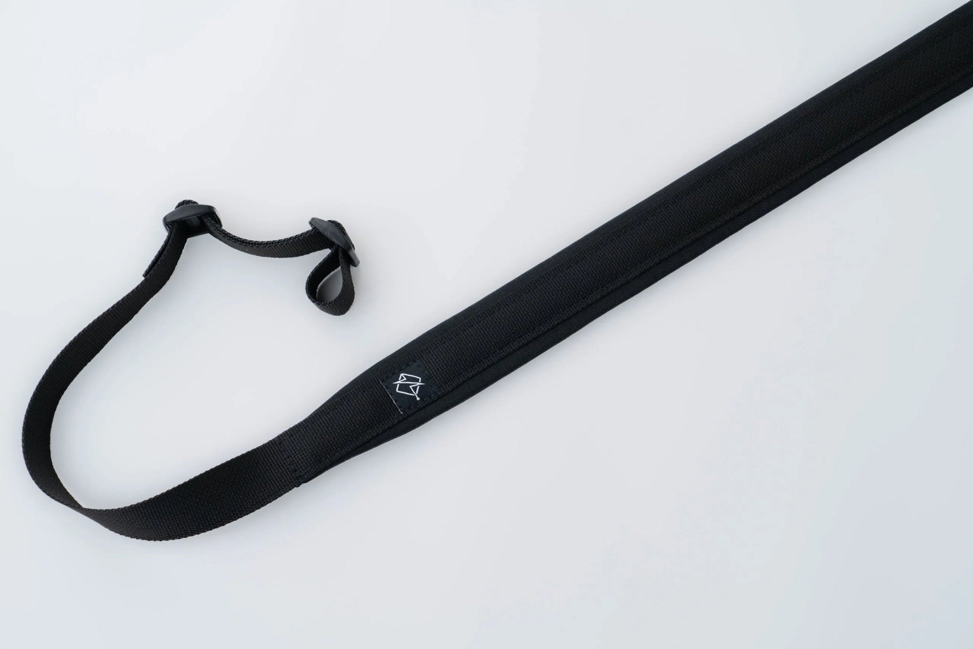 "Image of the Flatline Fiber Co. Padded Rifle Sling, featuring a durable, padded design for enhanced comfort during extended use, with adjustable straps and quick-release buckles for versatile and secure firearm carry."