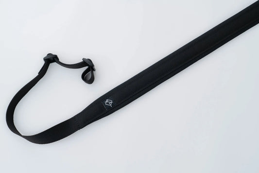 "Image of the Flatline Fiber Co. Padded Rifle Sling, featuring a durable, padded design for enhanced comfort during extended use, with adjustable straps and quick-release buckles for versatile and secure firearm carry."