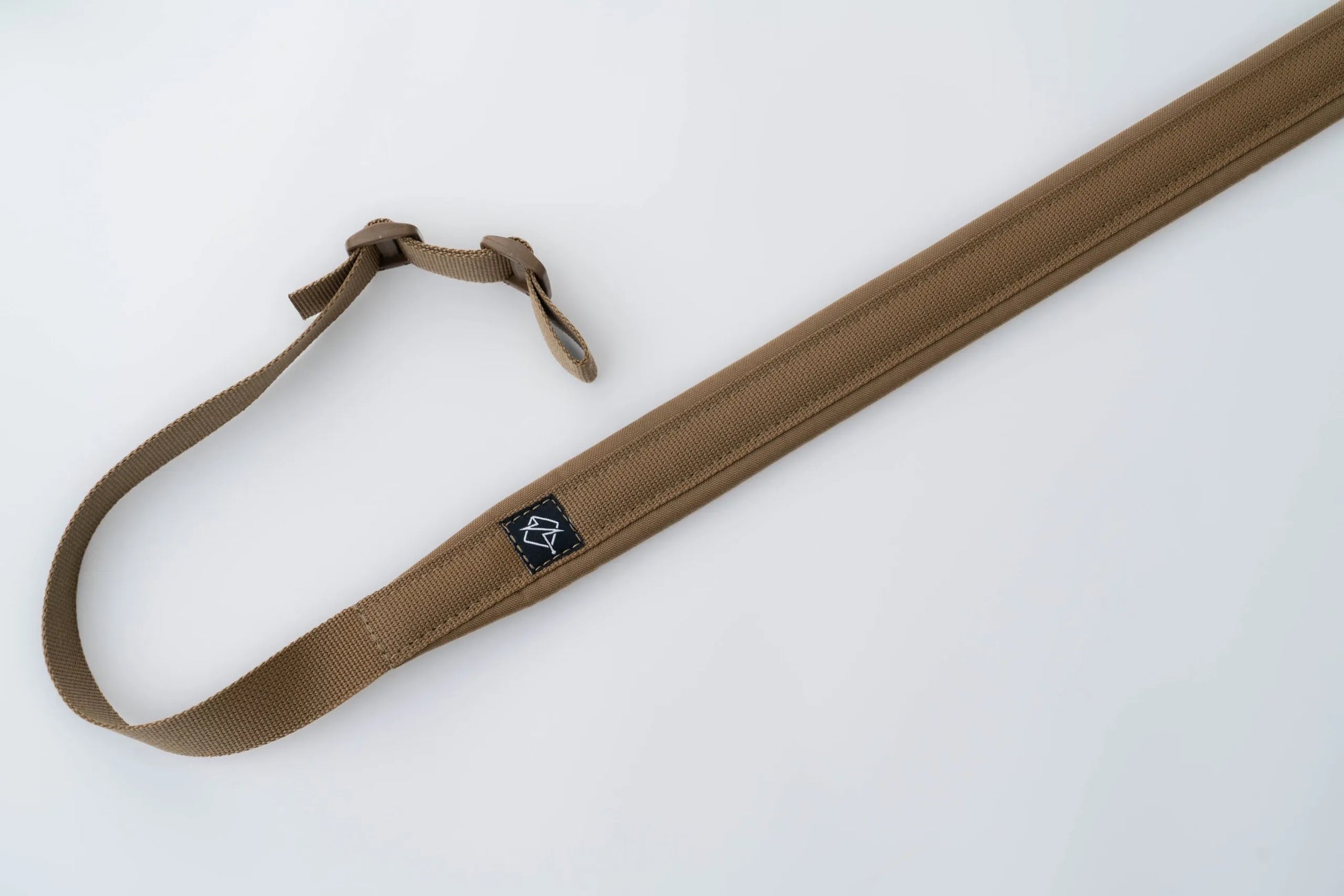 "Image of the Flatline Fiber Co. Padded Rifle Sling, featuring a durable, padded design for enhanced comfort during extended use, with adjustable straps and quick-release buckles for versatile and secure firearm carry."