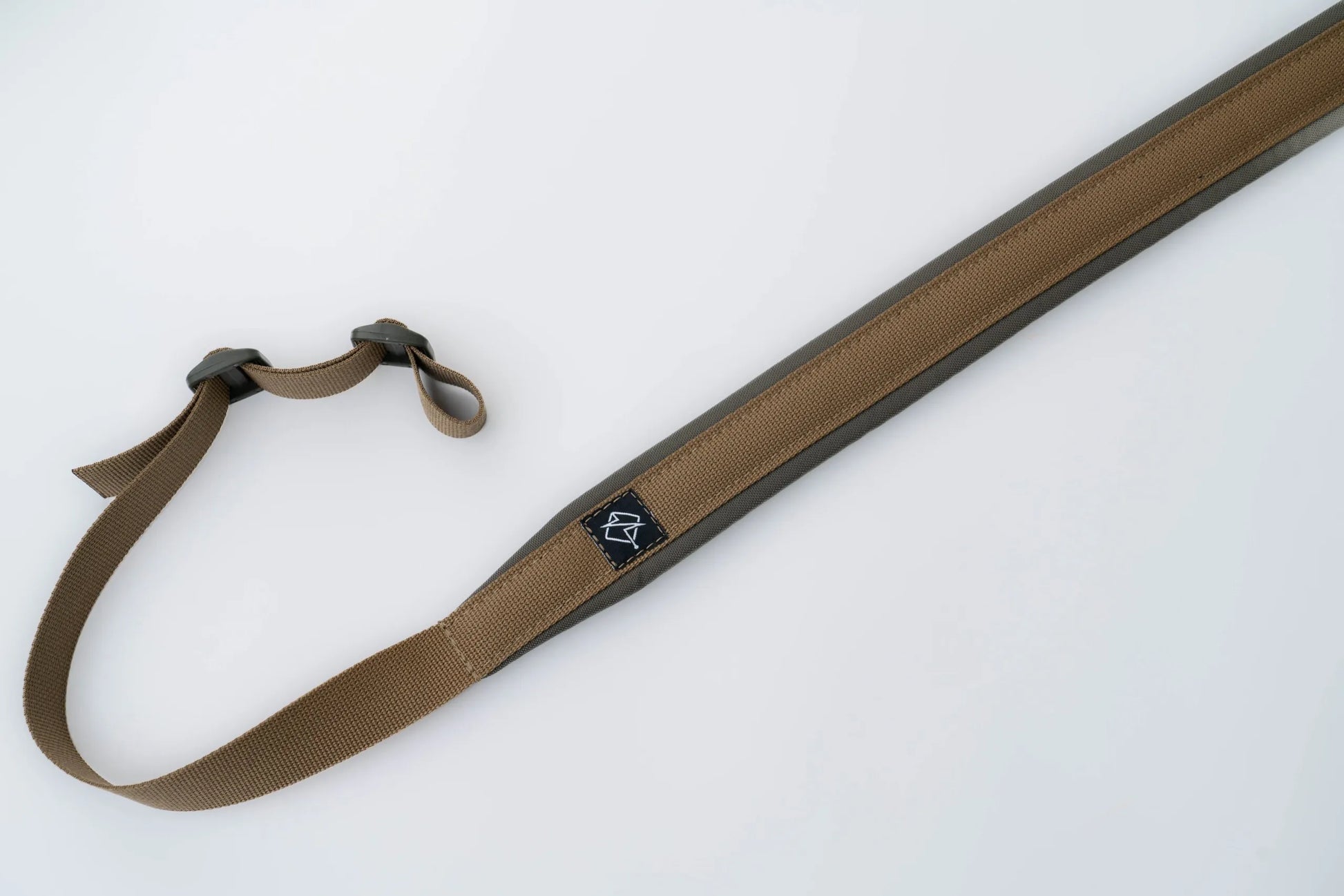 "Image of the Flatline Fiber Co. Padded Rifle Sling, featuring a durable, padded design for enhanced comfort during extended use, with adjustable straps and quick-release buckles for versatile and secure firearm carry."