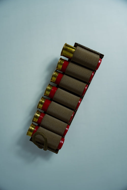 Image of the Esstac 7 Round 12 Gauge Shotgun Card, showcasing a durable, low-profile design with elastic loops for securely holding 7 shotgun shells. Ideal for rapid reloads and easy mounting on tactical gear.