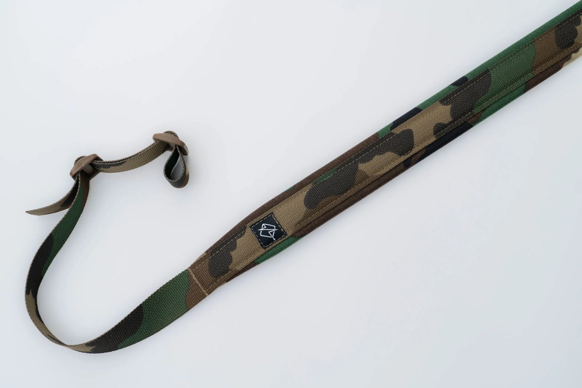 "Image of the Flatline Fiber Co. Padded Rifle Sling, featuring a durable, padded design for enhanced comfort during extended use, with adjustable straps and quick-release buckles for versatile and secure firearm carry."