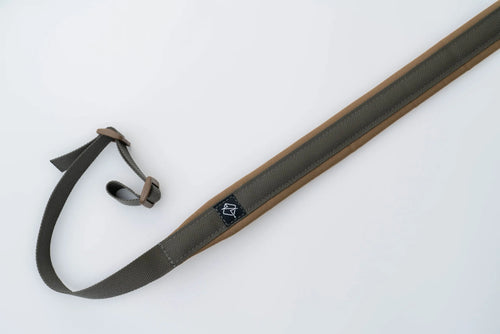 "Image of the Flatline Fiber Co. Padded Rifle Sling, featuring a durable, padded design for enhanced comfort during extended use, with adjustable straps and quick-release buckles for versatile and secure firearm carry."