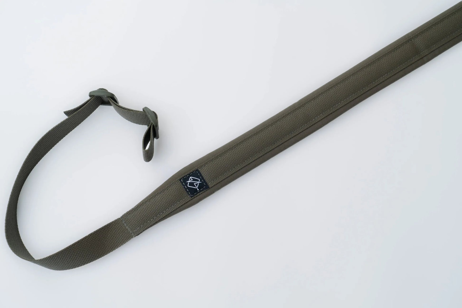 "Image of the Flatline Fiber Co. Padded Rifle Sling, featuring a durable, padded design for enhanced comfort during extended use, with adjustable straps and quick-release buckles for versatile and secure firearm carry."