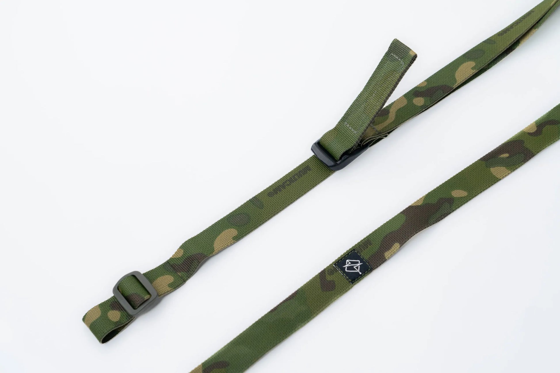 Close-up of quick-adjust pull tab and ladder lock on rifle sling