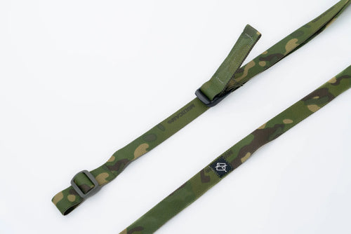 Close-up of quick-adjust pull tab and ladder lock on rifle sling