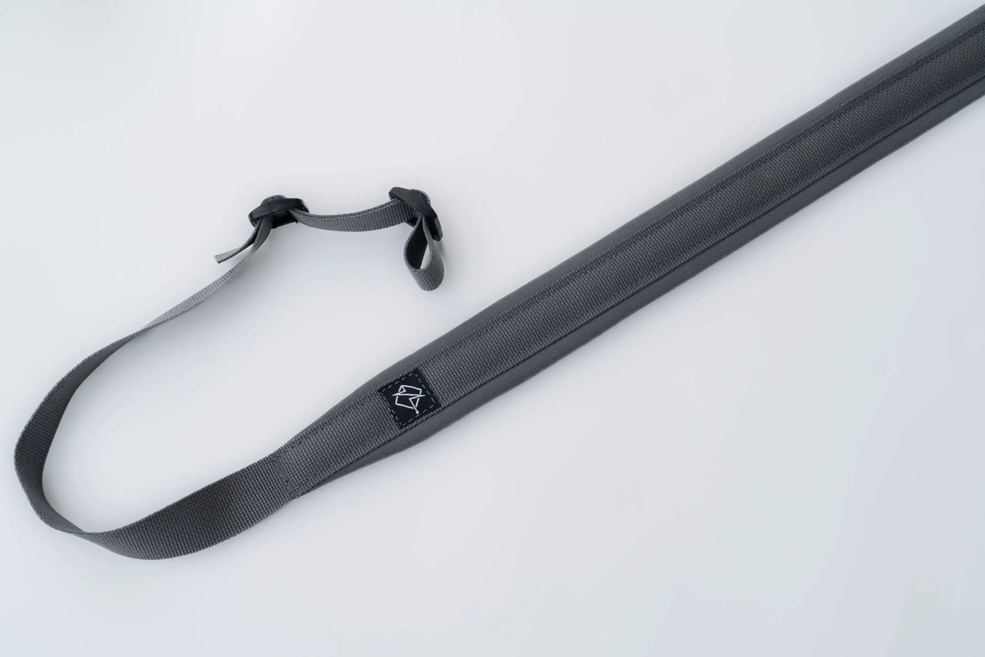 "Image of the Flatline Fiber Co. Padded Rifle Sling, featuring a durable, padded design for enhanced comfort during extended use, with adjustable straps and quick-release buckles for versatile and secure firearm carry."