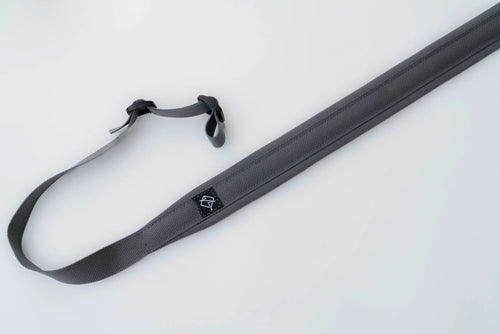"Image of the Flatline Fiber Co. Padded Rifle Sling, featuring a durable, padded design for enhanced comfort during extended use, with adjustable straps and quick-release buckles for versatile and secure firearm carry."